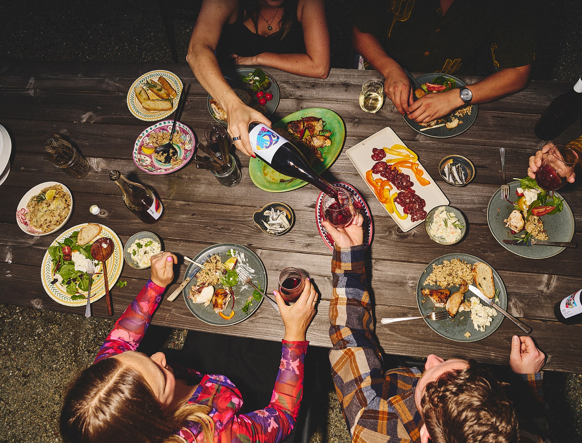People sharing food and wine