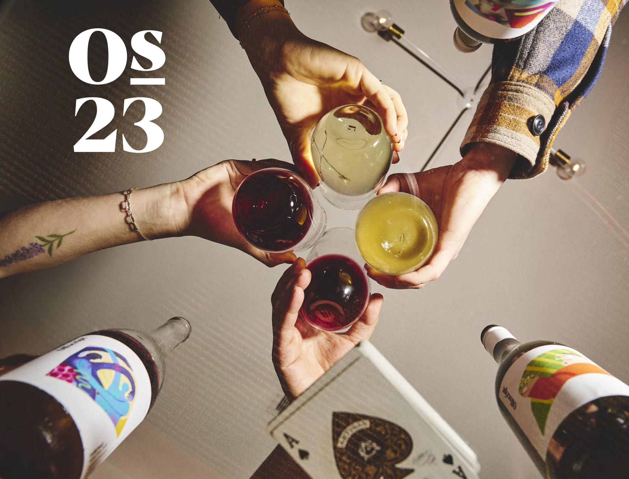 Four people drinking wine.